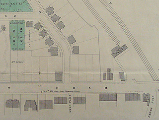 Another street plan showing the same area, with different plots marked in green.  Mr Stapleton’s plot now has a grey rectangle on it, indicating a building.